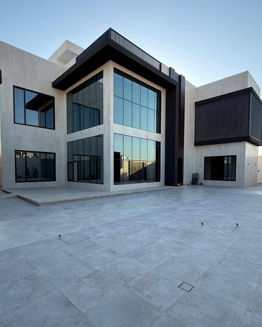Khalaf Villa after: finished glass and stone facade