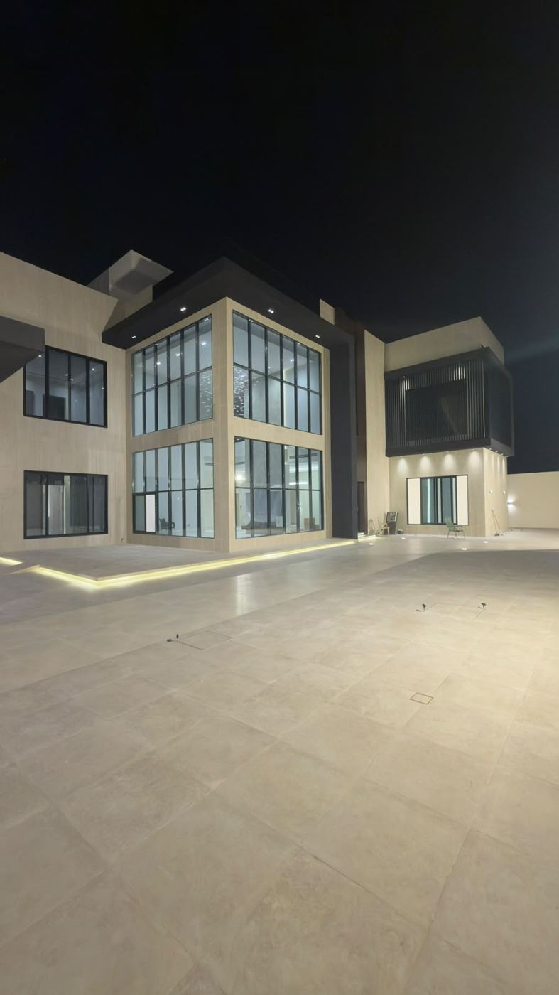 Villa exterior lit at night