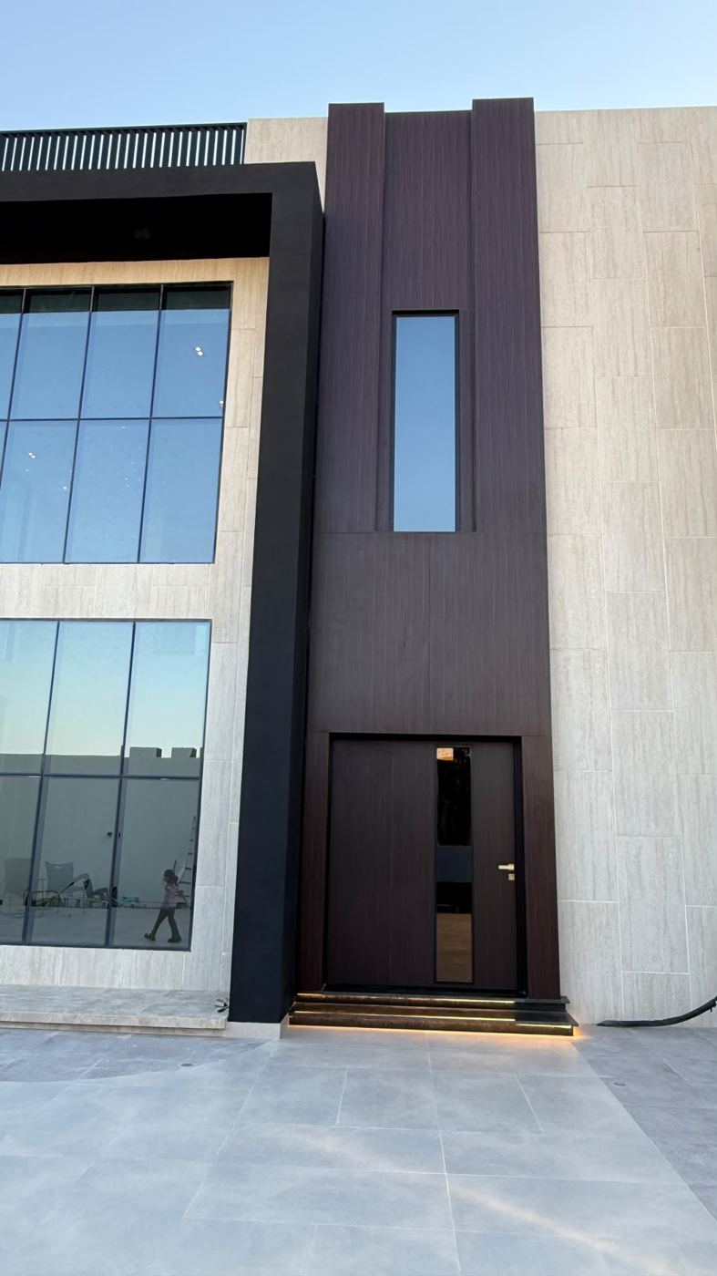 Main entrance with dark cladding