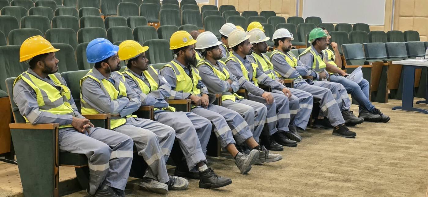 United Waves technicians in hard hats and hi-vis vests at a safety training session